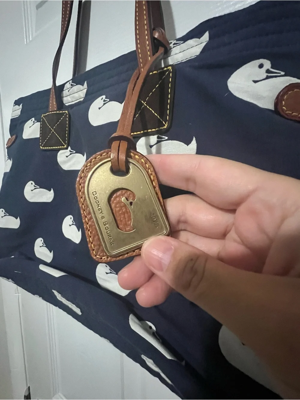 Dooney & Bourke Navy Tote with White Duck Print and Brown Leather Straps